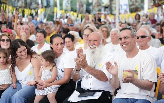 Released hostage Omri Miran, far right, his father Dani Miran, center, and Lishay Miran-Lavi, at Tel Aviv Hostages Square on October 31, 2025 (Alon Gilboa/Hostages and Missing Families Forum)