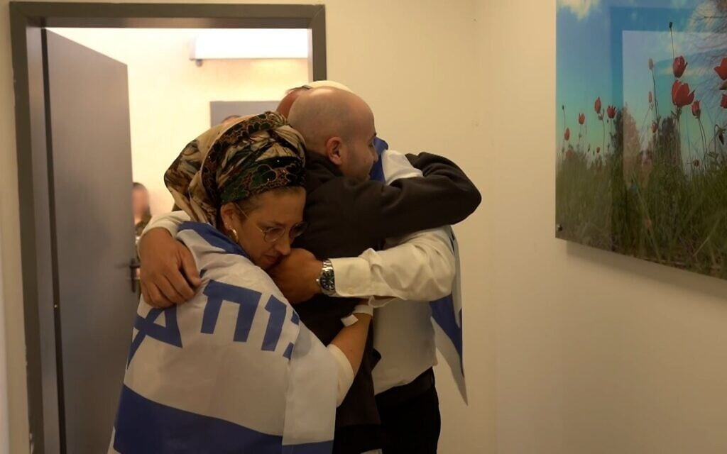 Freed hostage Eitan Mor meets his parents for the first time since his release from Hamas captivity in Gaza on October 13, 2025 (Israel Defense Forces)