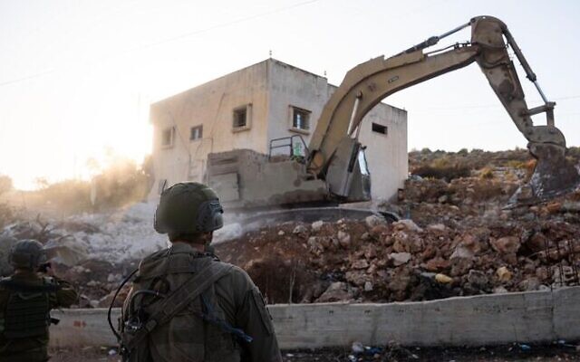 IDF troops demolish the home of Jamil Samarah in the West Bank town of Bruqin, October 22, 2025. (Israel Defense Forces) IDF troops demolish the home of Jamil Samarah in the West Bank town of Bruqin, October 22, 2025. (Israel Defense Forces)