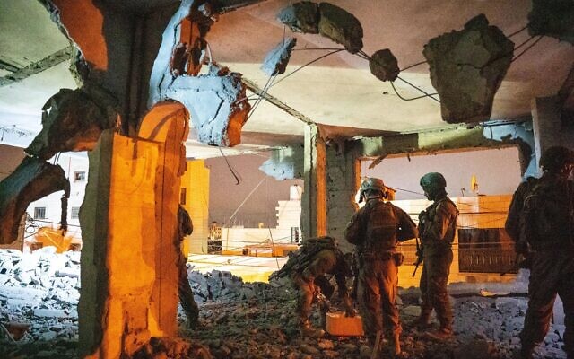 IDF troops are seen in a demolished home belonging to Palestinian terrorist Ahmad Himouni in the West Bank city of Hebron, on October 6, 2025. (Israel Defense Forces) IDF troops are seen in a demolished home belonging to Palestinian terrorist Ahmad Himouni in the West Bank city of Hebron, on October 6, 2025. (Israel Defense Forces)