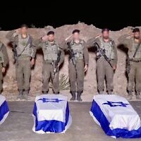 IDF troops salute over the caskets containing the bodies of slain hostages Guy Illouz, Bipin Joshi, Yossi Sharabi and Cpt. Daniel Perez in the Gaza Strip, late October 13, 2025. (Israel Defense Forces)