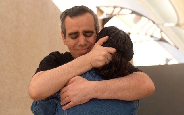 Released hostage Omri Miran reunites with his wife Lishay Miran-Lavi after over two years in Hamas captivity, at the Re'im base on October 13, 2025 (Israel Defense Forces)