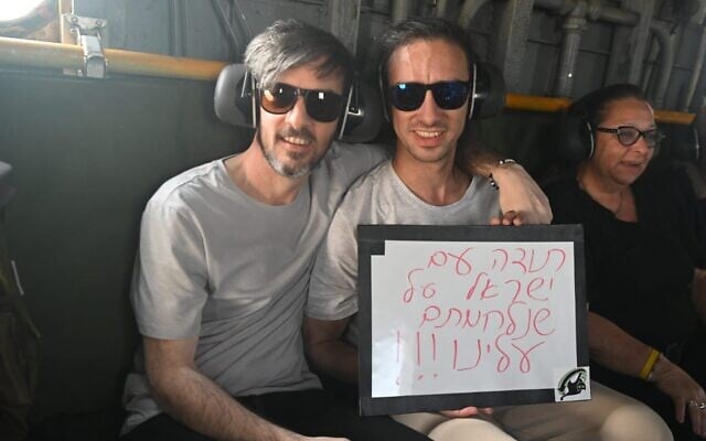 Freed hostages David (left) and Ariel Cunio in a helicopter on the way to the Sheba Medical Center after being released from Gaza on October 13, 2025. (IDF)
