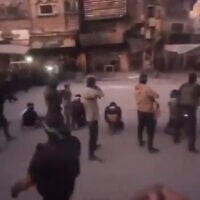 Palestinians accused of collaberation with Israel are seen blindfolded moments before their execution by Hamas gunmen in a Gaza street, October 13, 2025 (Screenshot: X)