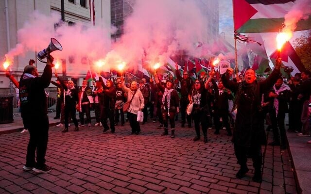 Anti-Israel, pro-Palestinian protesters gather ahead of the World Cup qualifying soccer match between Norway and Israel in Oslo, October 11, 2025. (Javad Parsa/NTB Scanpix via AP)