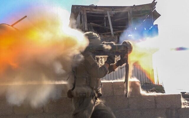 An IDF soldier fires a weapon in Gaza in an undated handout photo issued on October 24, 2025. (Israel Defense Forces)