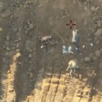 Image from IDF drone footage showing terror operatives staging the recovery of hostage remains on October 27, 2025 (Screen grab)