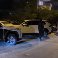 Police officers at the Jerusalem address of Shimon Gutman who was charged with murdering his caregiver, Haviva Vashdi, on October 30, 2025. (Screenshot, Israel Police)