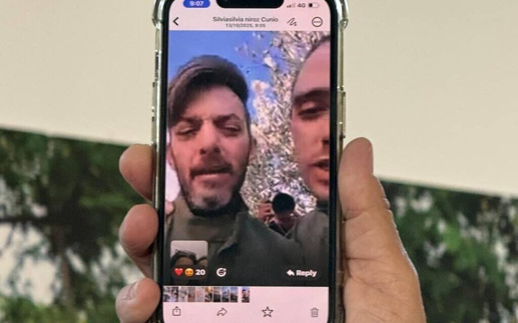An image of hostages David and Ariel Cunio in a video call while still in Hamas captivity on October 13, 2025 (Courtesy)