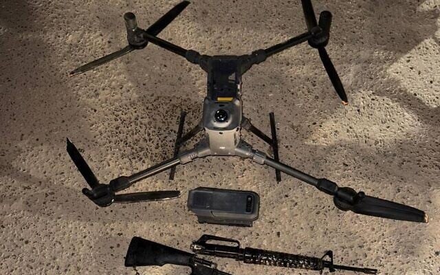Weapons and a drone that were seized by IDF troops following an attempted smuggling on the Egyptian border, October 17, 2025. (Israel Defense Forces)