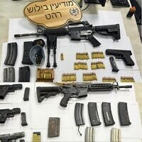 Weapons and ammunition seized by police forces in Rahat following the fatal shooting of a young man in the city on October 4, 2025. (Israel Police)