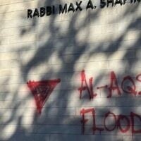 Graffiti was spray-painted on Temple Israel in Minneapolis on October 7, 2025, the two-year anniversary of Hamas's attack on Israel. (Lonny Goldsmith/TC Jewfolk via JTA)