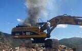 Smoke billows from an excavator after an Israeli strike on a man who the IDF says was trying to restore Hezbollah terrorist infrastructure, between the southern Lebanese towns of Yater and Zinqin, October 7, 2025. (Used in accordance with Clause 27a of the Copyright Law)