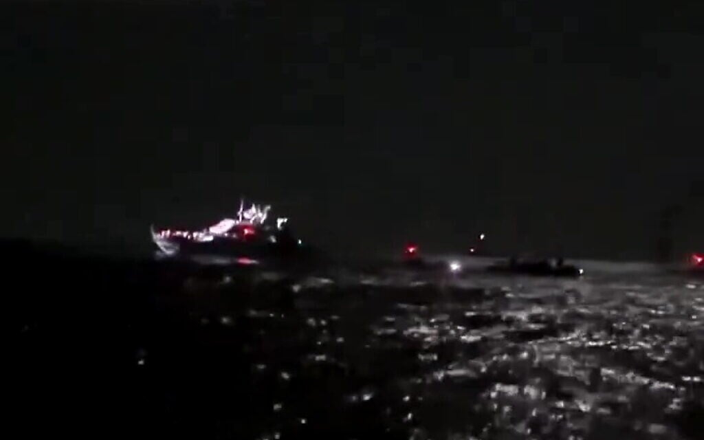 An Israeli Navy patrol boat is seen near vessels of the Sumud Global Flotilla in the Mediterranean Sea, October 1, 2025. (Screen capture/X)