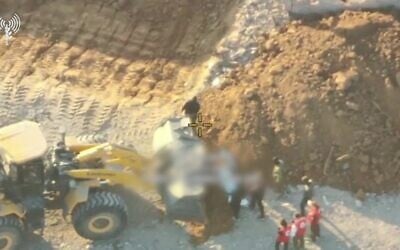 Hamas operatives are seen staging the "recovery" of the remains of a hostage in Gaza City, as Red Cross representatives look on, October 27, 2025. (Israel Defense Forces)