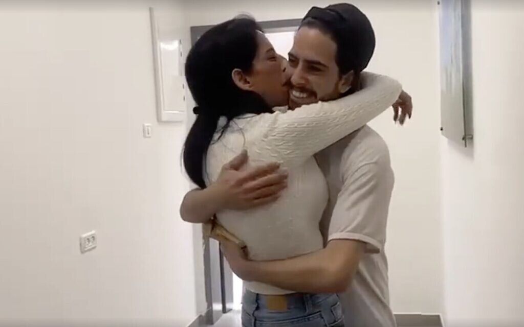 The moment Einav Zangauker was reunited with her son, freed hostage Matan, after he was held in Gaza for over two years, in Re'im on October 13, 2025 (Screen grab)