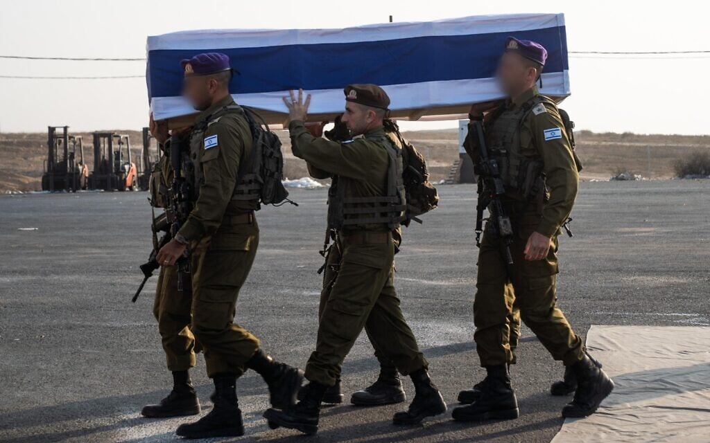 IDF troops carry the casket containing the body of hostage Lt. Hadar Goldin after it was returned by Hamas, during a ceremony in the Gaza Strip, November 9, 2025. (Israel Defense Forces)