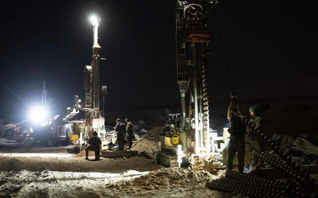 IDF troops work to uncover Hamas tunnels in southern Gaza's Rafah, in a handout photo issued by the military on November 21, 2025. (Israel Defense Forces)