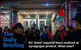 The entrance to Park East Synagogue, with dueling protesters on each side, separated by police, in New York City, November 19, 2025. (Luke Tress/Times of Israel)