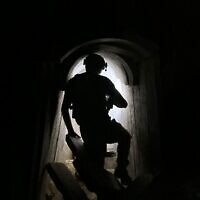 A combat engineer of the elite Yahalom unit inside a major Hamas tunnel in southern Gaza, where the IDF says the body of Lt. Hadar Goldin had been held by the terror group in recent years, November 20, 2025. (Israel Defense Forces)