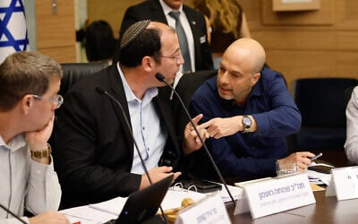 MK Simcha Rothman (L) argues with legal adviser to the Constitution, Law and Justice Committee Gur Bligh at the Knesset in Jerusalem, November 24, 2025. (Noam Moshkovitz/Knesset spokesperson office)