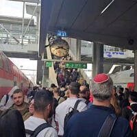 Screengrab of a social media video showing thousands of commuters backed up at Tel Aviv's HaHagana rail station after a man was killed on the tracks near the station, November 30, 2025. (X)