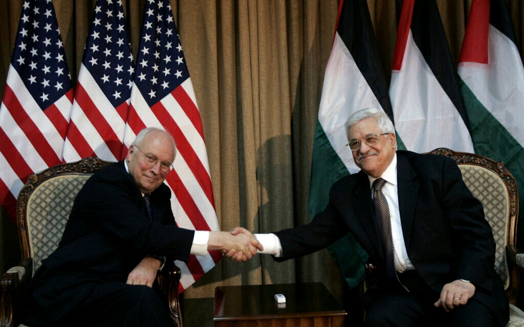 US Vice-President Dick Cheney (L) shakes hands with Palestinian Authority President Mahmoud Abbas during their meeting in Ramallah on March 23, 2008. (Photo by POOL / AFP)