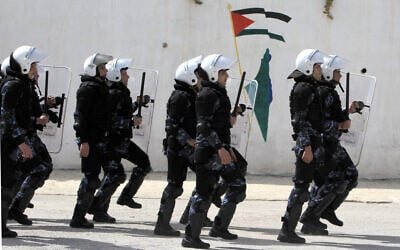 Palestinian police march during a training session with members of the European Union, in the West Bank city of Ramallah, on March 16, 2014. (Abbas Momani / AFP)