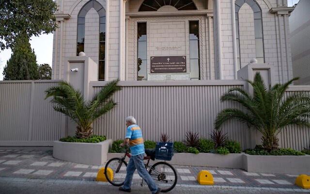 A man pushes a bicycle past the new Syriac Orthodox Mor Ephrem Church on the eve of its official inauguration in Istanbul on October 7, 2023. (YASIN AKGUL / AFP) A man pushes a bicycle past the new Syriac Orthodox Mor Ephrem Church on the eve of its official inauguration in Istanbul on October 7, 2023. (YASIN AKGUL / AFP)