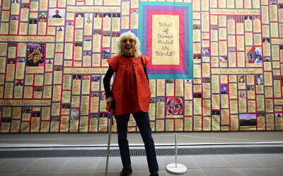 Judy Chicago stands in front of one of her artworks entitled 'What if Women Ruled the World' during a press preview for the exhibition 'Judy Chicago: Revelations' at the Serpentine North gallery in London on May 21, 2024. (Photo by HENRY NICHOLLS / AFP)