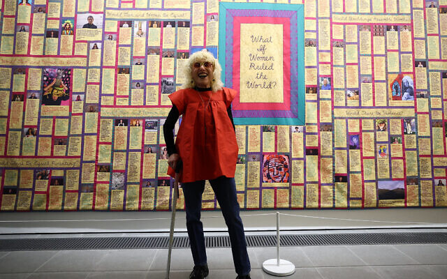 Judy Chicago stands in front of one of her artworks entitled 'What if Women Ruled the World' during a press preview for the exhibition 'Judy Chicago: Revelations' at the Serpentine North gallery in London on May 21, 2024. (Photo by HENRY NICHOLLS / AFP)