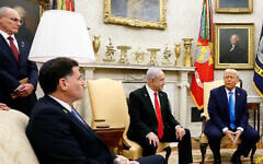 US President Donald Trump, accompanied by (L-R) Strategic Affairs Minister Ron Dermer and Prime Minister Benjamin Netanyahu, speaks during a meeting in the Oval Office of the White House on February 4, 2025 in Washington, DC, as Israeli Ambassador to the US Yechiel Leiter looks on. (Anna Moneymaker/Getty Images via AFP)