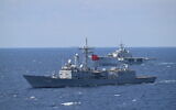 A picture taken from a Turkish Navy drone-carrying amphibious assault ship, shows a Turkish Frigate and an Italian vessel during a NATO exercise in the Adriatic Sea on September 24, 2025. (Alberto PIZZOLI / AFP)