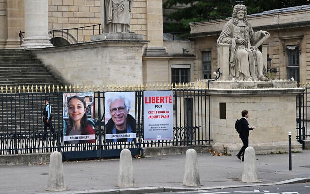 This photograph shows portrait placards of Cecile Kohler and Jacques Paris, two French citizens detained in Iran, set up on a fence of the French National Assembly, in Paris, France, on October 6, 2025. (Martin LELIEVRE / AFP) This photograph shows portrait placards of Cecile Kohler and Jacques Paris, two French citizens detained in Iran, set up on a fence of the French National Assembly, in Paris, France, on October 6, 2025. (Martin LELIEVRE / AFP)
