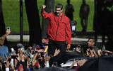 Venezuela's President Nicolas Maduro waves to supporters during a march to commemorate the 'Day of Indigenous Resistance' in the capital Caracas on October 12, 2025. (Federico PARRA / AFP)