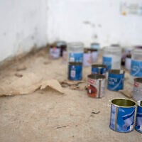 A candle bearing the portrait of 24-year-old Yulia Chaban, who was killed on the beach in Zikim during Hamas' October 7, 2023, attacks, is left inside a bomb shelter on the beach in the southern Israeli Kibbutz of Zikim, the closest Israeli beach to the Gaza Strip, on October 16, 2025. (Maya Levin / AFP)