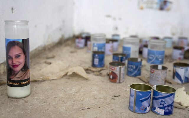 A candle bearing the portrait of 24-year-old Yulia Chaban, who was killed on the beach in Zikim during Hamas' October 7, 2023, attacks, is left inside a bomb shelter on the beach in the southern Israeli Kibbutz of Zikim, the closest Israeli beach to the Gaza Strip, on October 16, 2025. (Maya Levin / AFP)