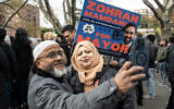 Supporters of Democratic New York City mayoral candidate Zohran Mamdani pose for a selfie during a campaign event on November 1, 2025, in the Queens borough of New York City. (STEPHANIE KEITH / GETTY IMAGES NORTH AMERICA / Getty Images via AFP)