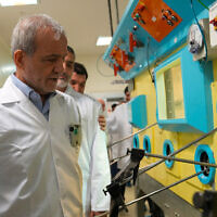 This handout picture made available by the Iranian Atomic Organization (IAEO) office on November 2, 2025, shows Iranian President Masoud Pezeshkian during a visit to the Atomic Energy Organization of Iran, to meet with senior managers in the nuclear industry in Tehran. (Photo by Handout / Iranian Atomic Organization (IAEO) / AFP)