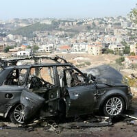 Illustrative: The wreckage of a vehicle is left strewn on the side of the road, a day after an Israeli airstrike that killed its occupants, in the southern Lebanese village of Kfar Roummane, in the Nabatieh district on November 2, 2025. (MAHMOUD ZAYYAT / AFP)