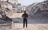 A Hamas gunman stands in Gaza City on November 2, 2025. (Omar AL-QATTAA / AFP)