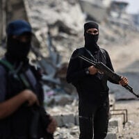 Armed Hamas members are seen guarding an area in Gaza City on November 3, 2025. (Omar AL-QATTAA / AFP)