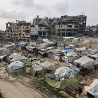 Palestinians walk around their tents in Gaza City on November 3, 2025. (Omar AL-QATTAA / AFP)
