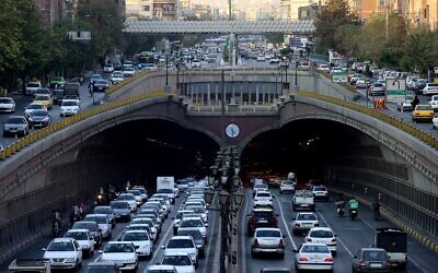 Commuters drive along the Nawab Highway underpass in Tehran on November 3, 2025. (ATTA KENARE / AFP)