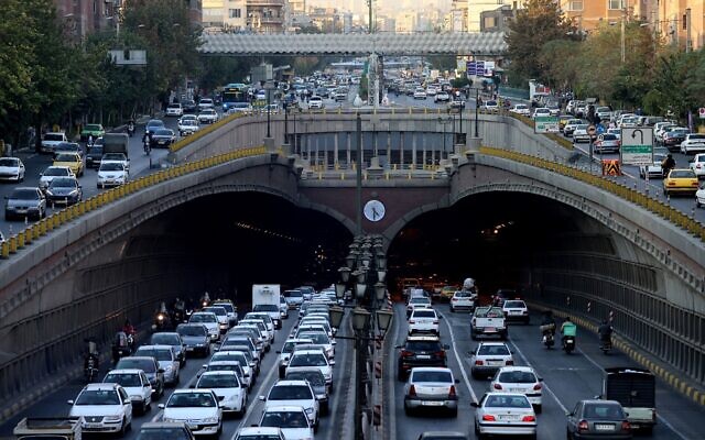 Commuters drive along the Nawab Highway underpass in Tehran on November 3, 2025. (ATTA KENARE / AFP) Commuters drive along the Nawab Highway underpass in Tehran on November 3, 2025. (ATTA KENARE / AFP)