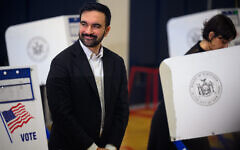 Democratic Mayoral candidate Zohran Mamdani reacts as his wife, Rama Duwaji, votes at The Frank Sinatra School of the Arts on November 4, 2025, in Queens, New York City. (Alexi J. Rosenfeld / GETTY IMAGES NORTH AMERICA / Getty Images via AFP)