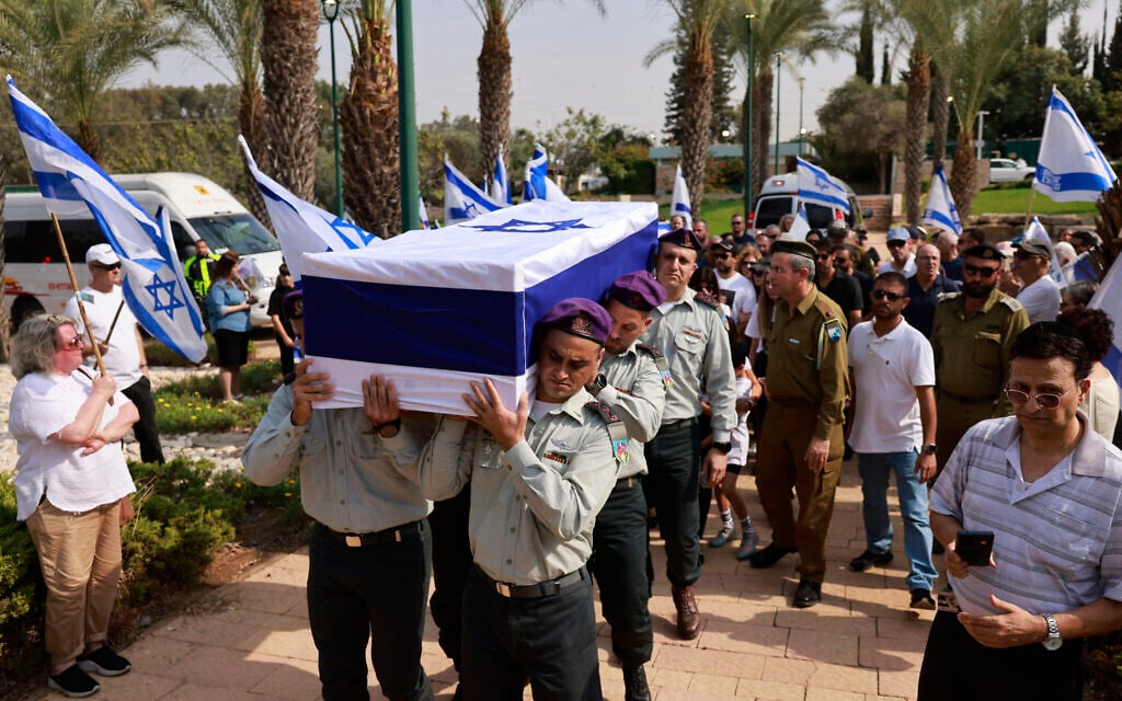 Israeli soldiers carry the coffin of Col. Asaf Hamami, Israel's highest-ranking officer killed by Hamas on Oct. 7, at the Kiryat Shaul Military Cemetery in Tel Aviv on November 4, 2025, following the return of his body (Menahem Kahana / AFP)