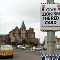 A poster that reads 'Give Zionism the red card' is seen on a lamp post near Villa Park in Birmingham on November 6, 2025 ahead of the UEFA Europa League league-stage football match between Aston Villa and Maccabi Tel Aviv. (Photo by Oli SCARFF / AFP)