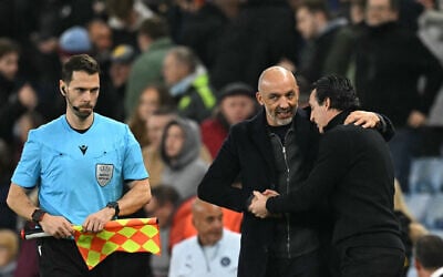 Aston Villa's Spanish manager Unai Emery (right) and Maccabi Tel Aviv's Serbian coach Zarko Lazetic (left) shake hands after the final whistle in the UEFA Europa League league-stage football match between Aston Villa and Maccabi Tel Aviv at Villa Park in Birmingham on November 6, 2025. (Oli SCARFF / AFP)