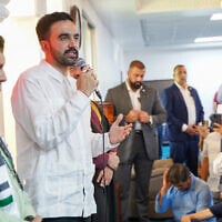 New York City Mayor elect Zohran Mamdani in white shirt, speaks to members of the Centro Islamico del Caribe -Masjid Ebadur Rahman mosque, San Juan, Puerto Rico, on November 7, 2025. (Angel Valentin / GETTY IMAGES NORTH AMERICA / Getty Images via AFP)